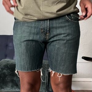 Ripped Levi Jean shorts.